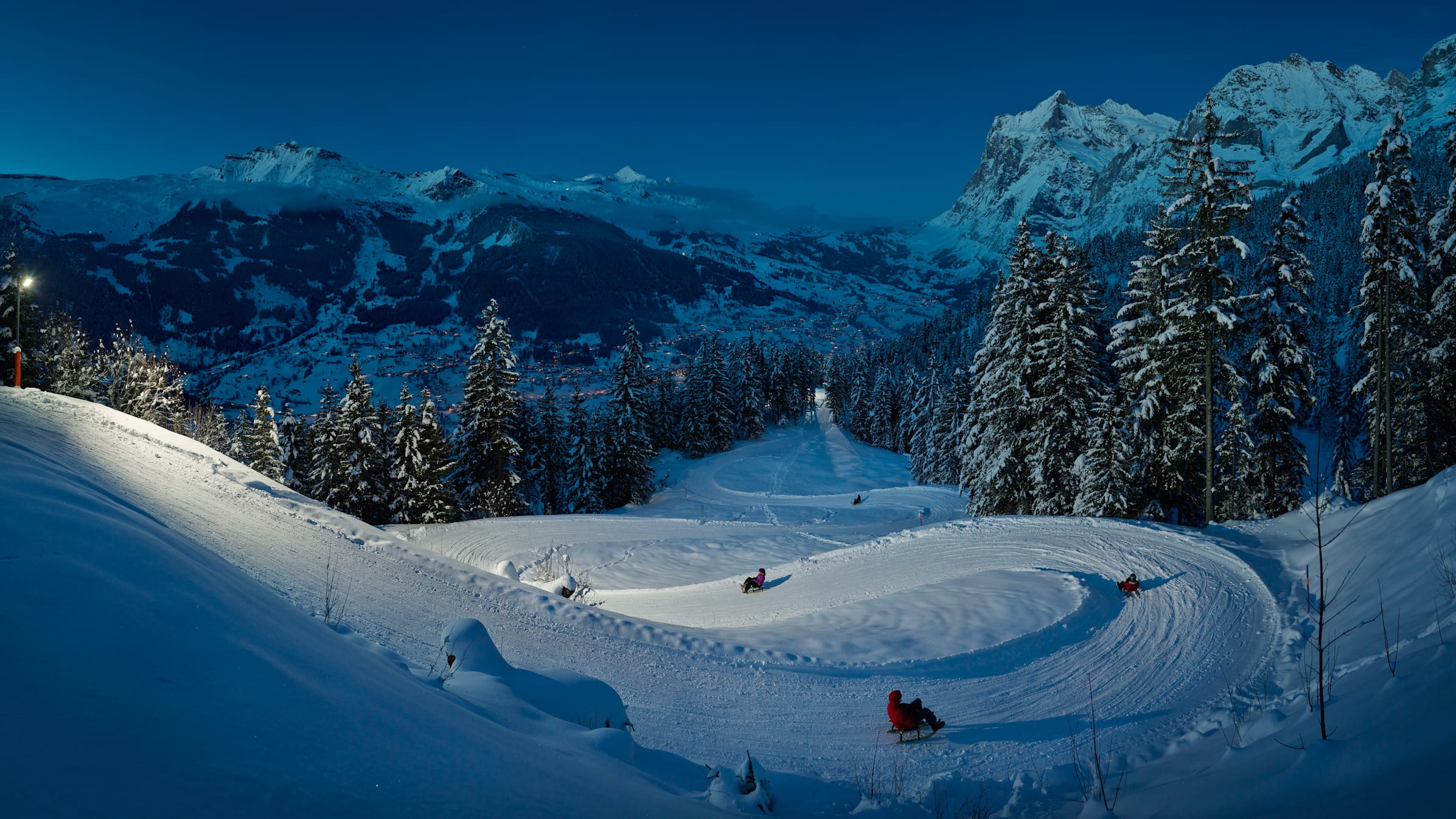 Schlitteln Eiger Run Nacht Grindelwald Panorama